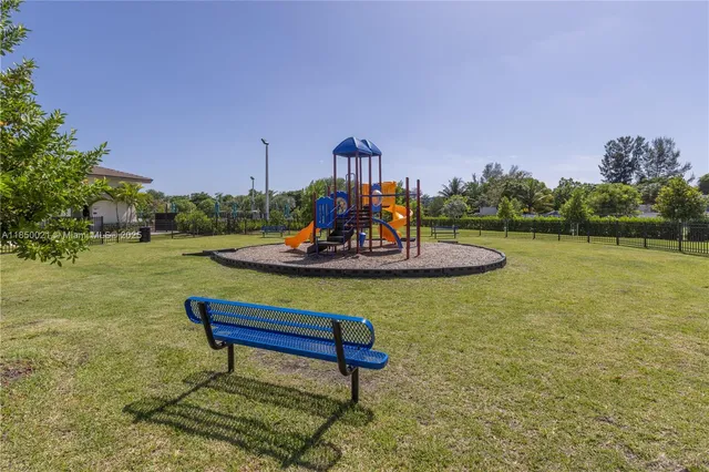 a room with gym equipment and a large window