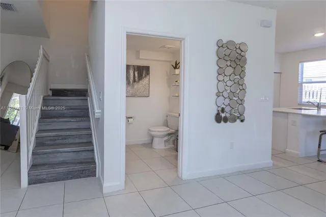 a view of room with stair and toilet