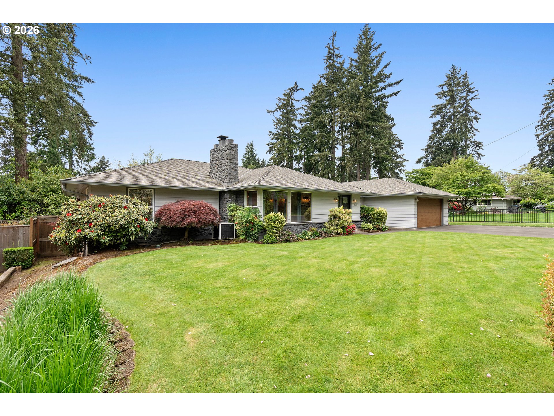 11465 Southwest 92nd Avenue Portland, OR 97223 - Photo 1 of 47 a front view of a house with a garden