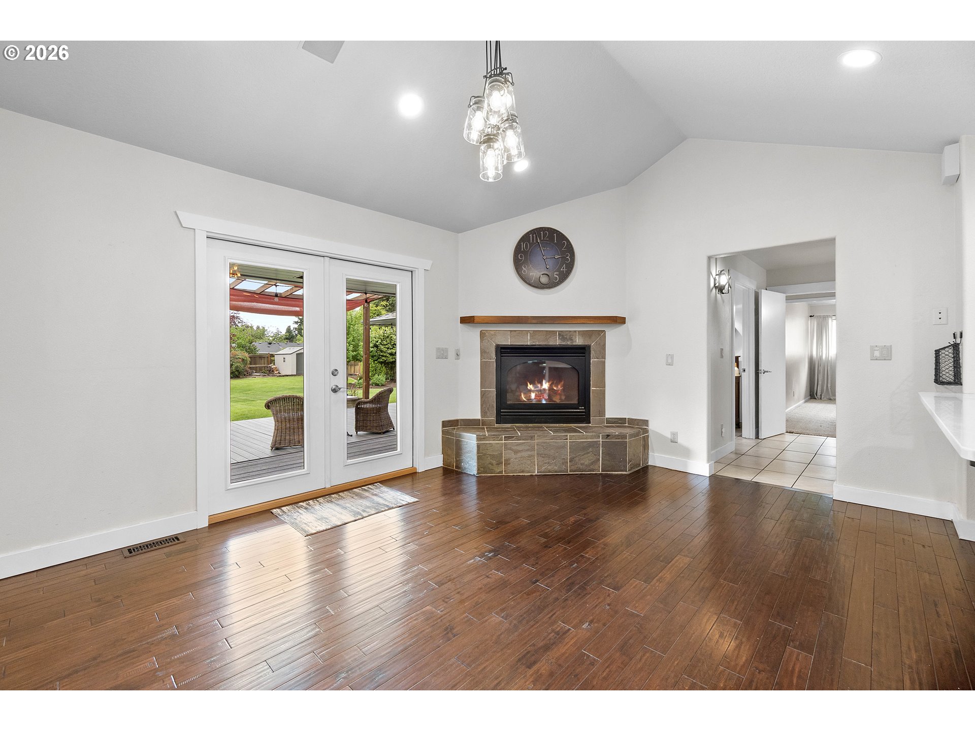 11465 Southwest 92nd Avenue Portland, OR 97223 - Photo 11 of 47 a view of an empty room with wooden floor fireplace and a window