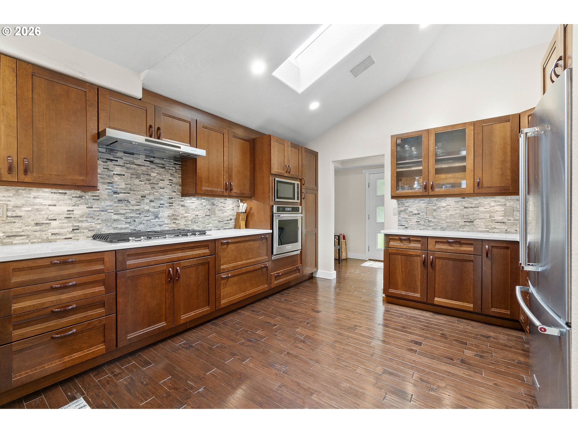 11465 Southwest 92nd Avenue Portland, OR 97223 - Photo 18 of 47 a kitchen with stainless steel appliances granite countertop a stove a sink and a microwave