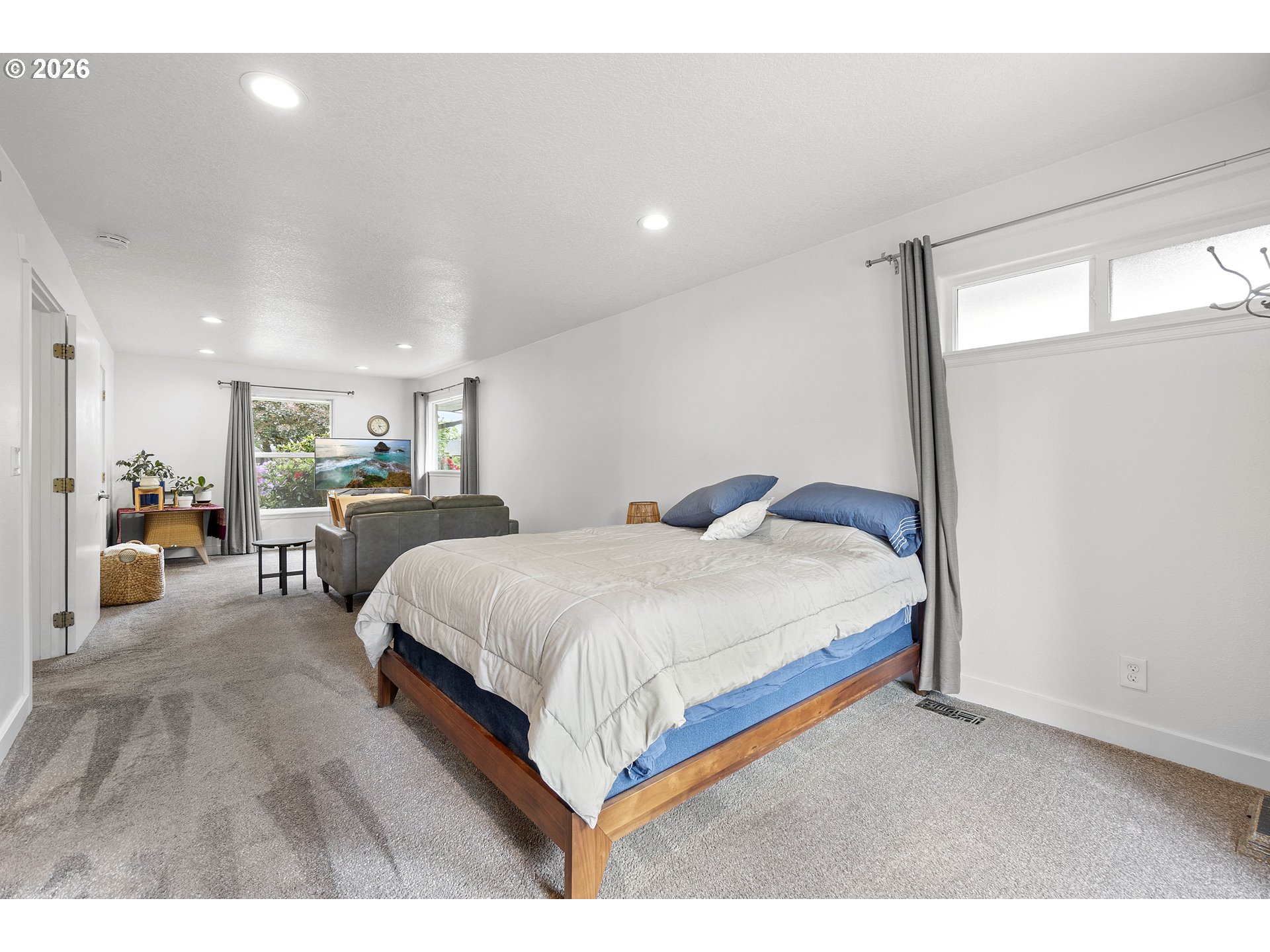11465 Southwest 92nd Avenue Portland, OR 97223 - Photo 20 of 47 a spacious bedroom with a bed lamp and window
