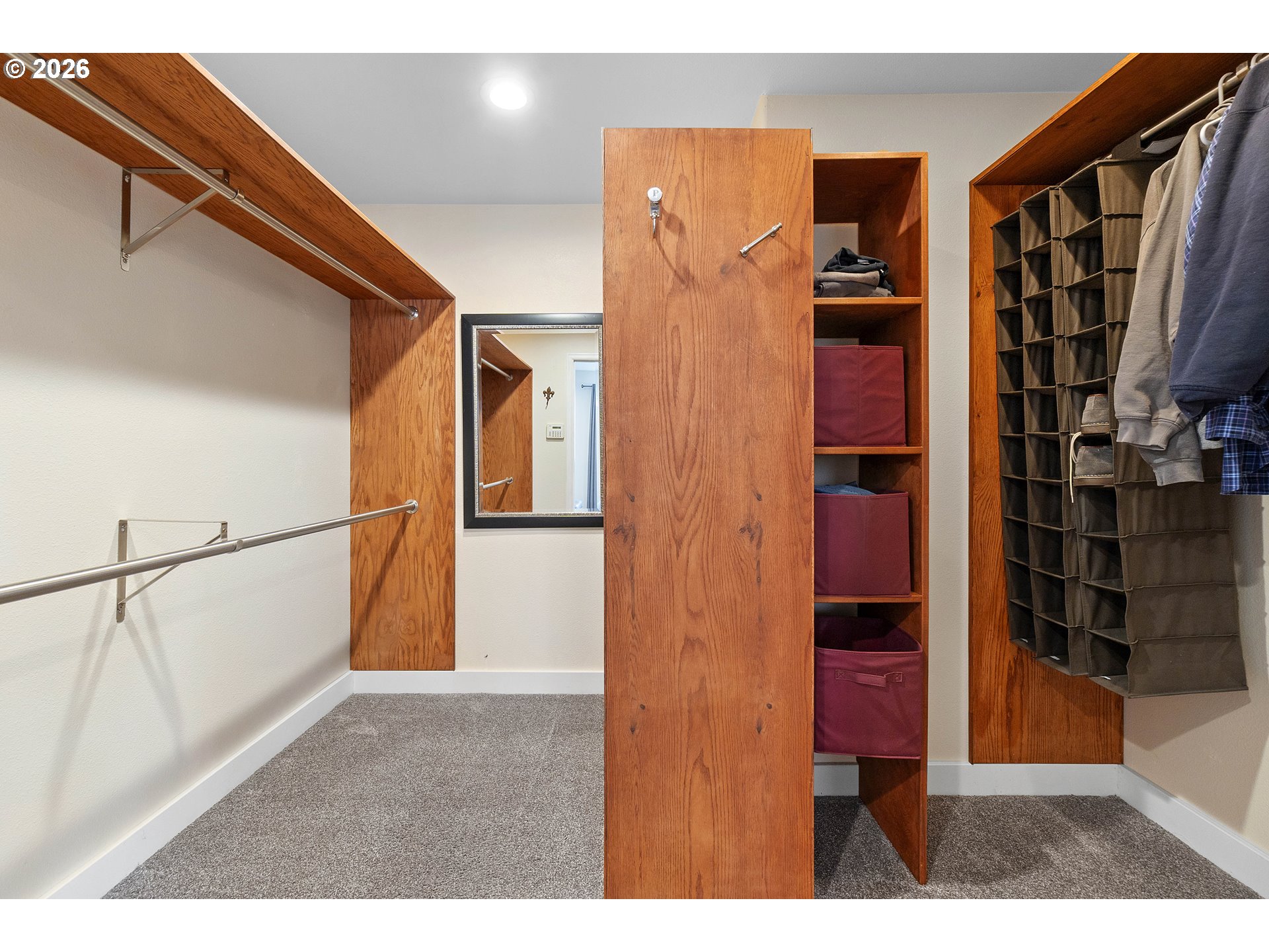 11465 Southwest 92nd Avenue Portland, OR 97223 - Photo 24 of 47 a view of walk in closet with clothes and shoes