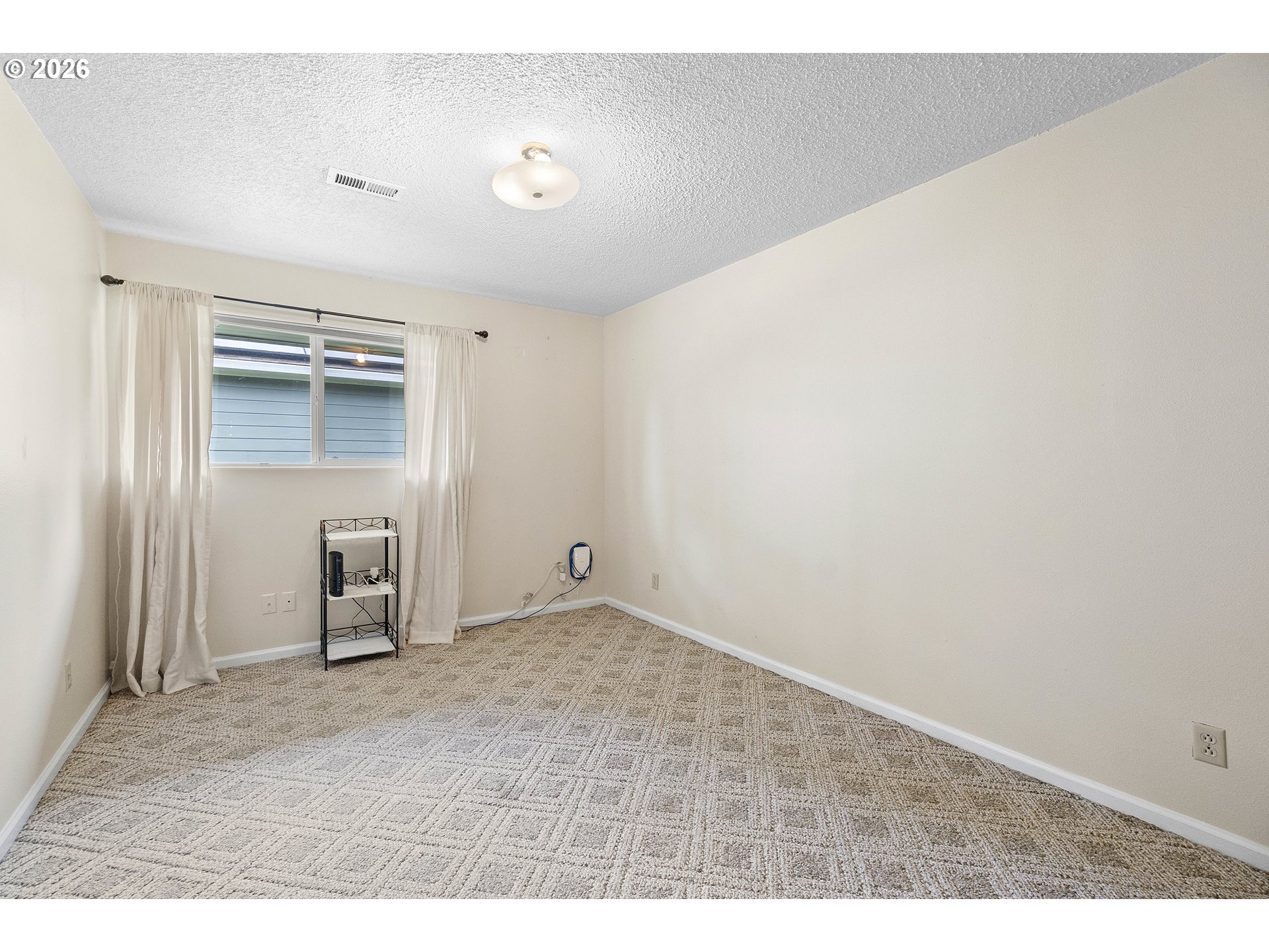 11465 Southwest 92nd Avenue Portland, OR 97223 - Photo 27 of 47 an empty room with closet and a window
