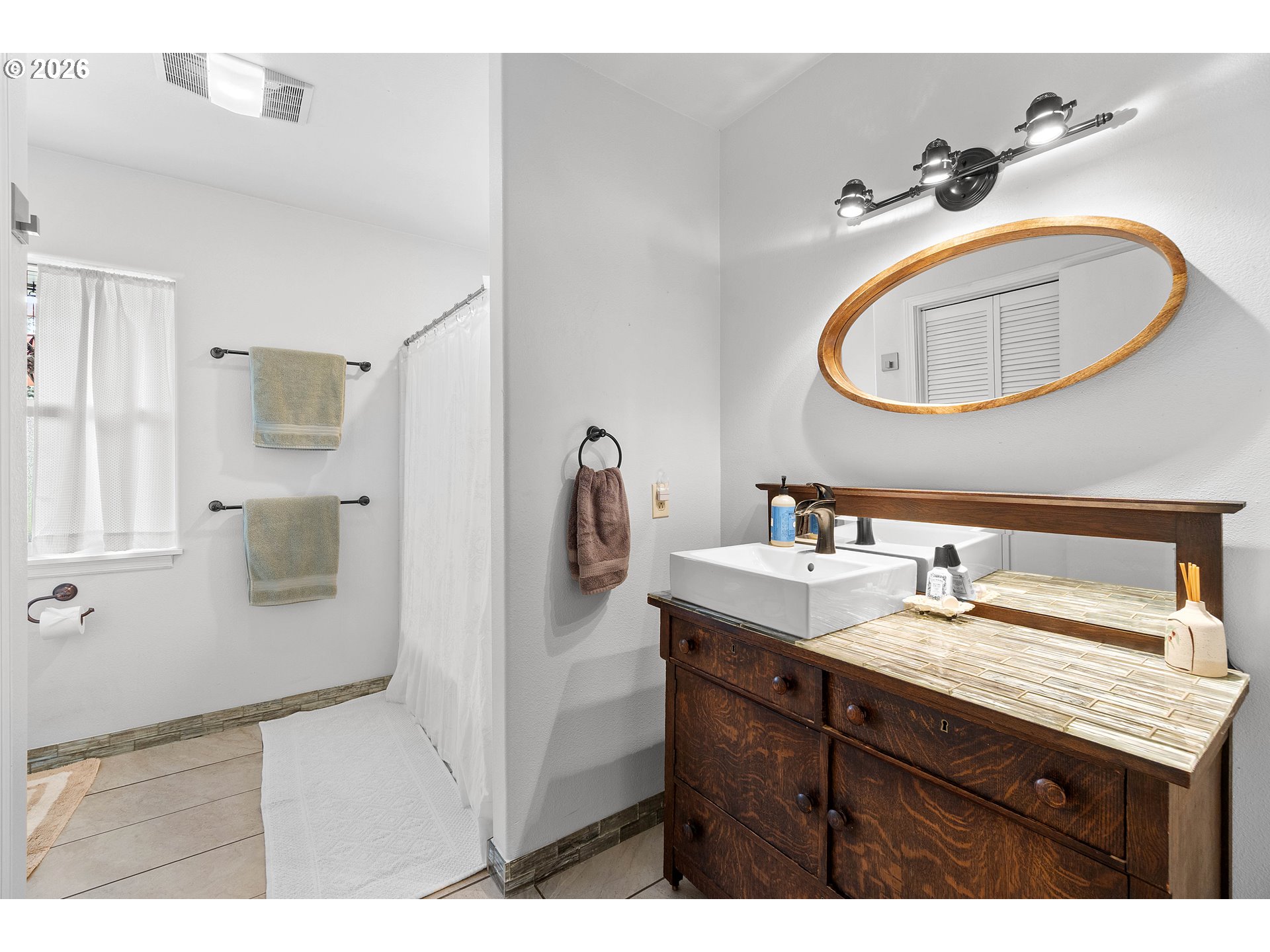 11465 Southwest 92nd Avenue Portland, OR 97223 - Photo 31 of 47 a bathroom with a sink and a mirror