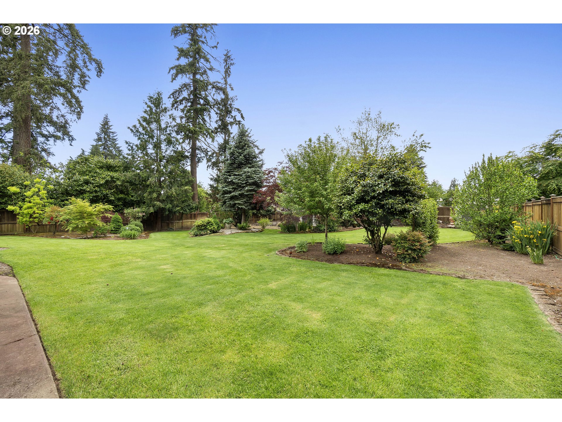 11465 Southwest 92nd Avenue Portland, OR 97223 - Photo 44 of 47 a view of a field with trees in the background