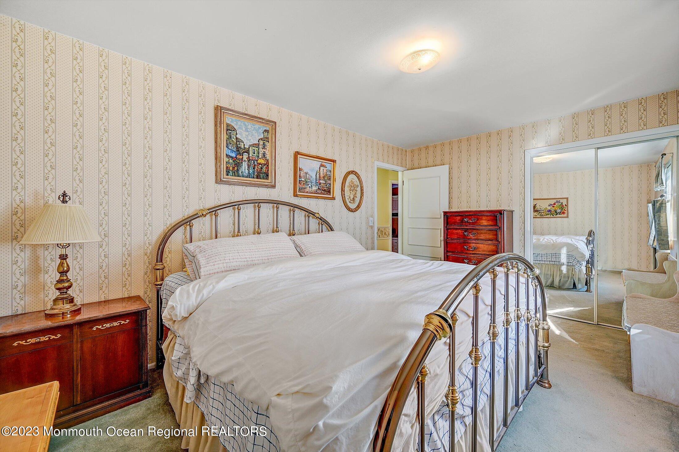 40 Smith Street Howell, NJ 07731 - Photo 15 of 25 a bedroom with a bed and a chandelier