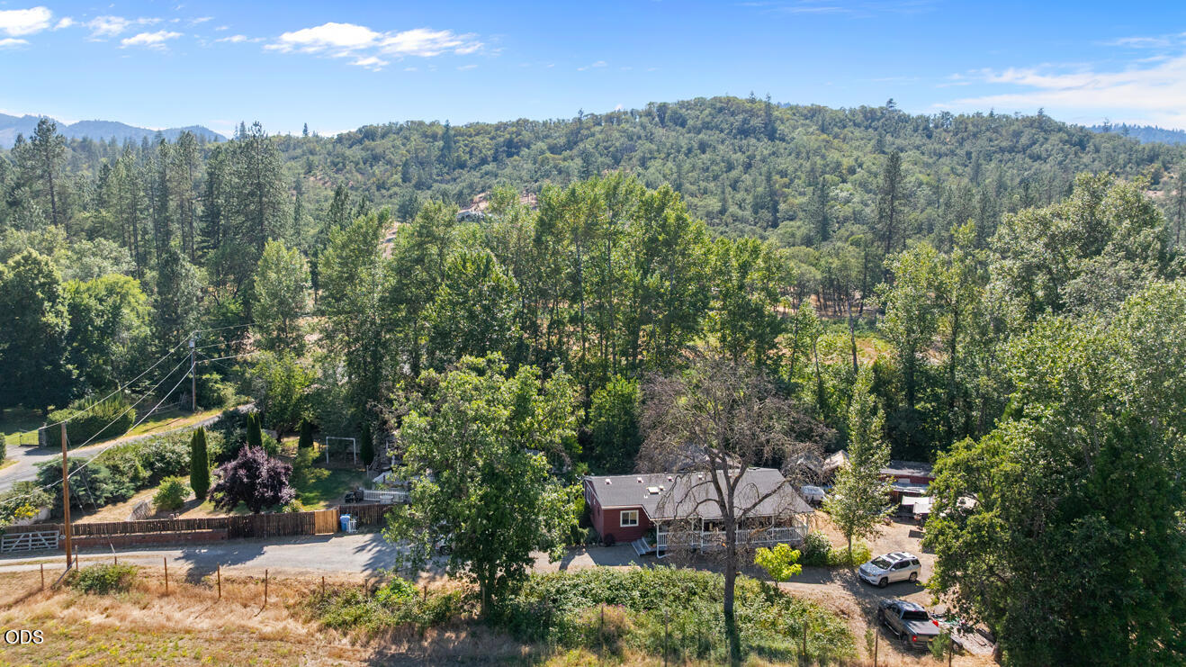 690 Foots Creek Road Gold Hill, OR 97525 - Photo 44 of 45 a view of a city with lush green forest