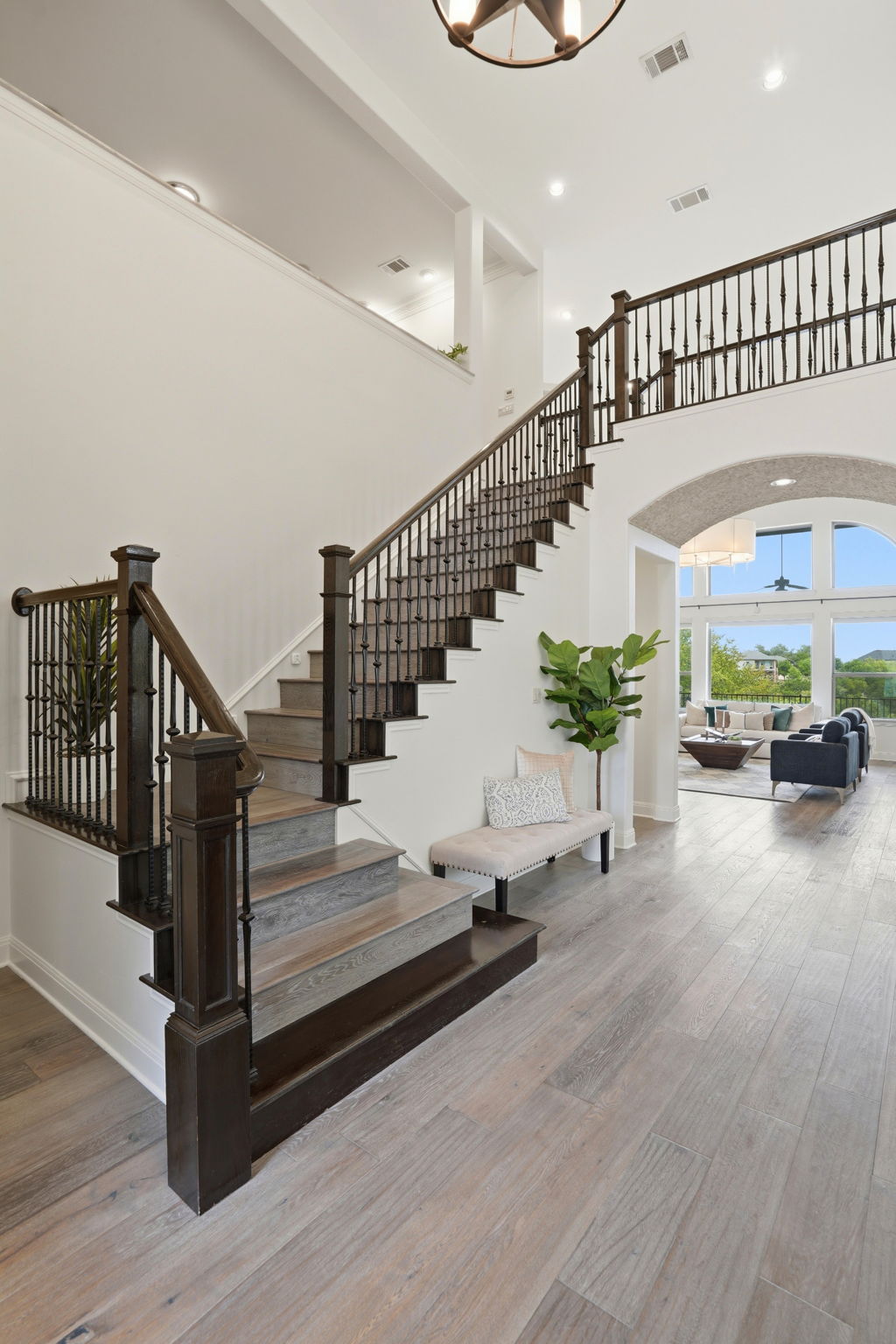 2420 Legend Trail Leander, TX 78641 - Photo 24 of 40 This sweeping staircase leads up to a massive bonus room and three additional bedrooms and 2 baths.