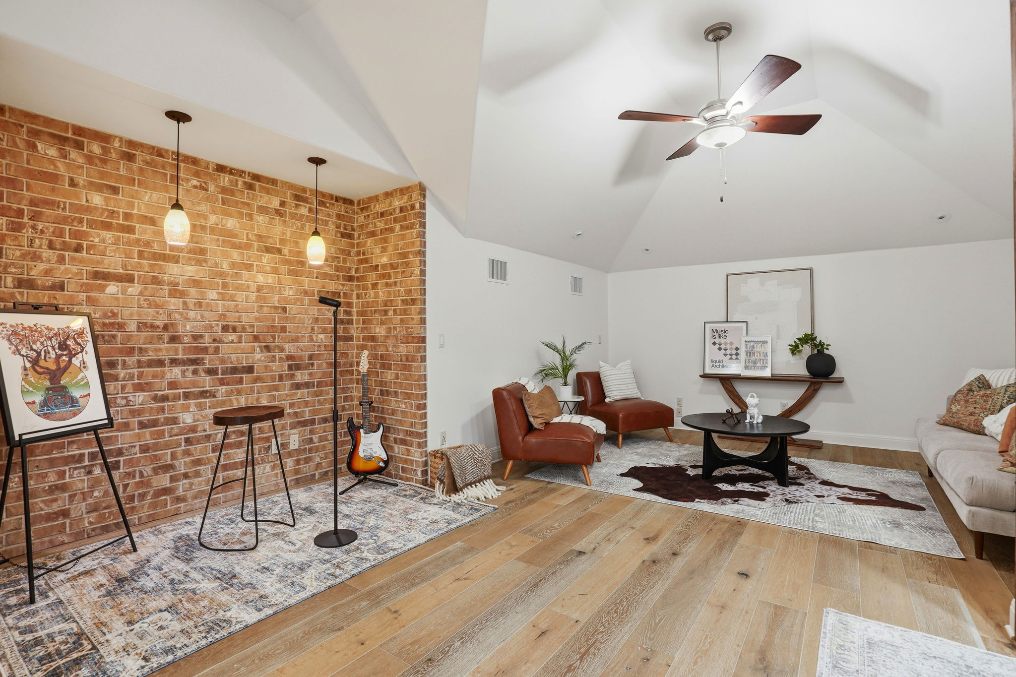 2420 Legend Trail Leander, TX 78641 - Photo 26 of 40 Let the creativity flow in this versatile bonus space. The exposed brick accent wall and pendant lighting create a spot perfect for a jam session or a relaxed reading nook.