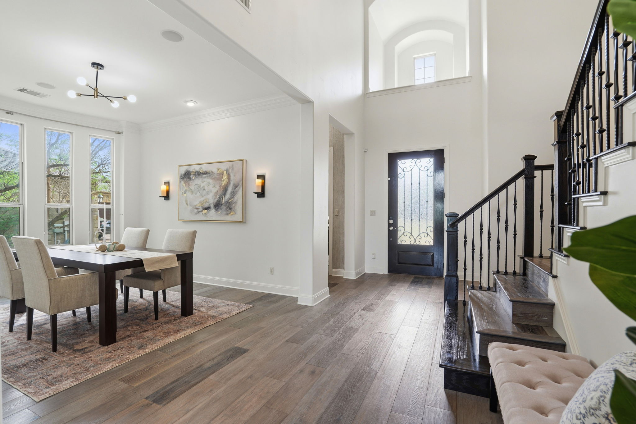 2420 Legend Trail Leander, TX 78641 - Photo 3 of 40 Stepping inside reveals a foyer that balances warmth and style with beautiful wide plank flooring that runs through the main living areas.