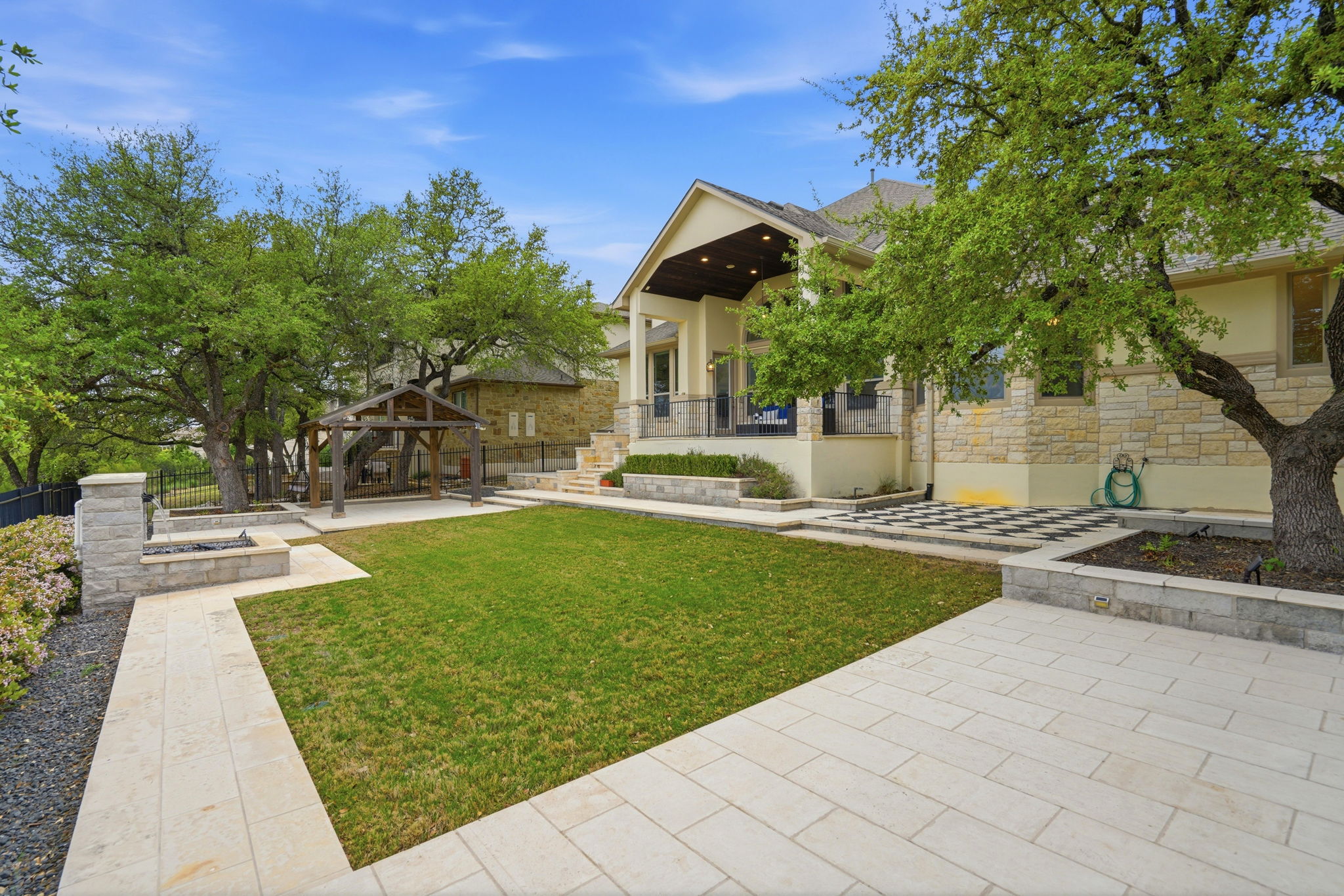 2420 Legend Trail Leander, TX 78641 - Photo 36 of 40 This angle showcases the homes multi-tiered backyard layout. From the manicured lawn to the pergola, this is a true private sanctuary designed for entertaining.