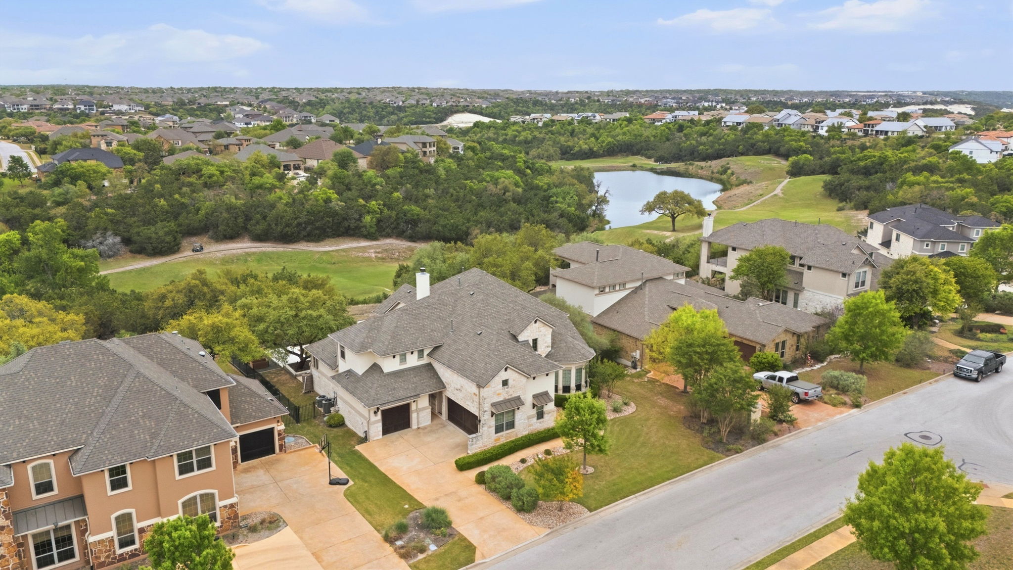 2420 Legend Trail Leander, TX 78641 - Photo 38 of 40 Location is key. This sweeping aerial shot highlights the property’s proximity to a sparkling golf course pond and the rolling green hills that make the 78641 zip code one of the most sought-after areas in Central Texas.