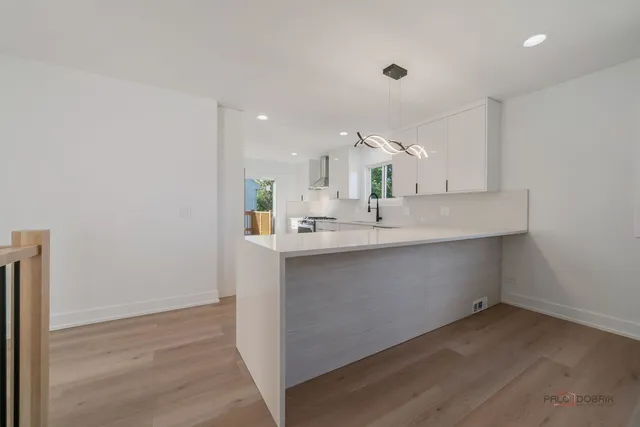 a kitchen with a sink cabinets and window