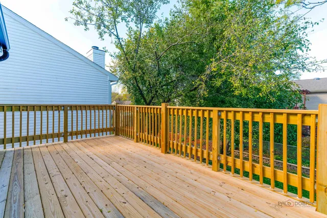 a view of wooden balcony with wooden floor