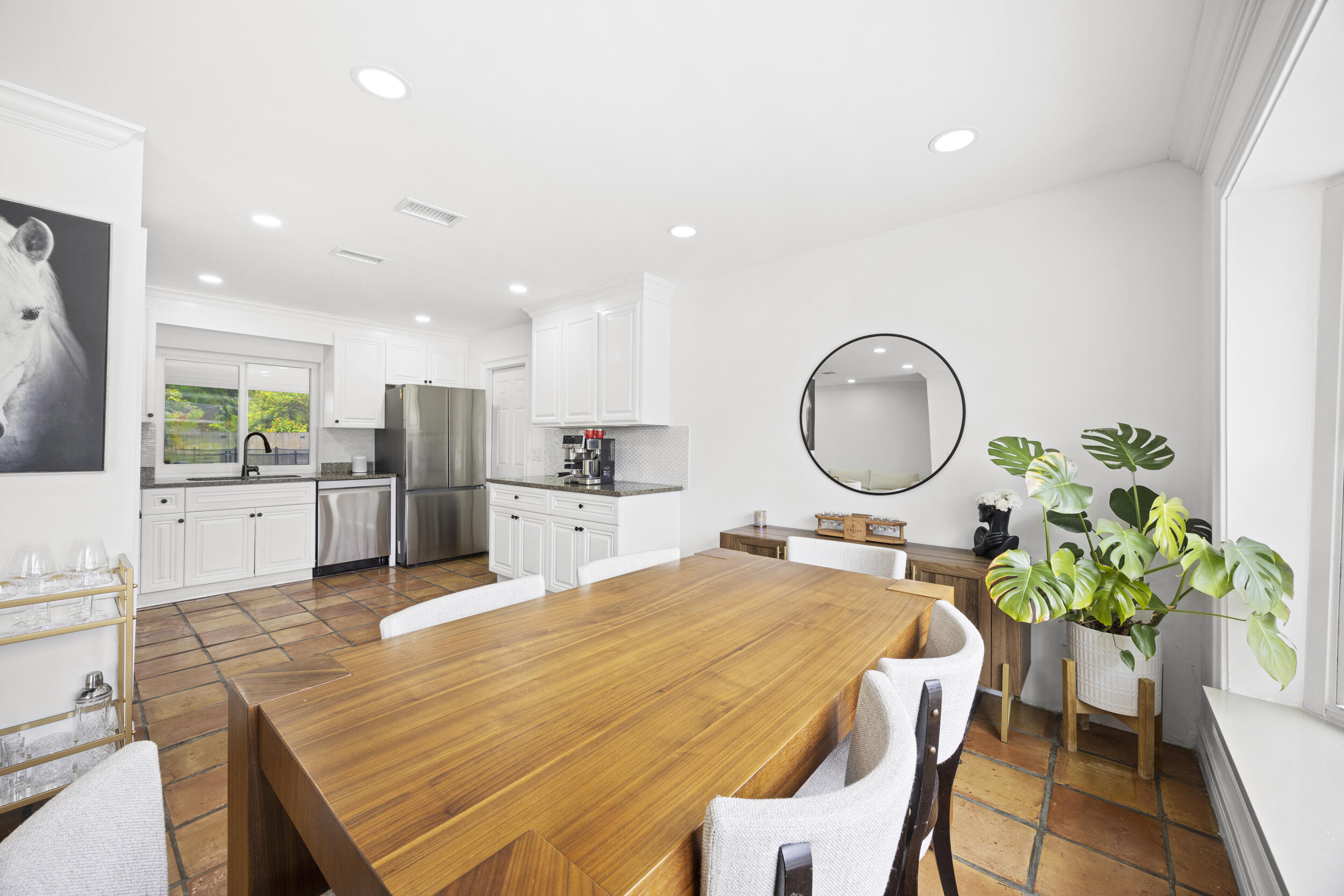 11760 Inverness Circle Wellington, FL 33414 - Photo 11 of 33 a swimming pool with a dining table chairs and a dining table with wooden floor