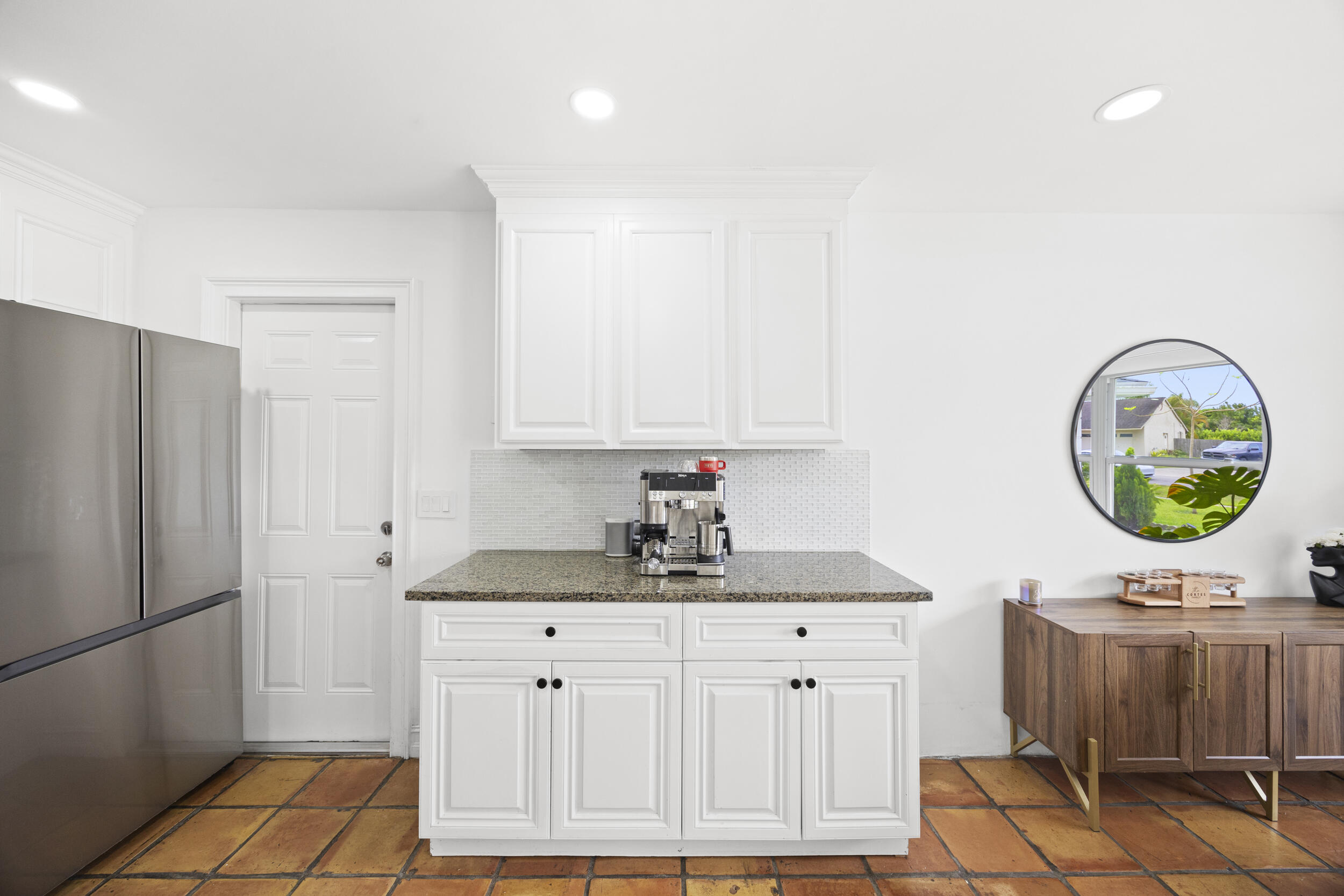 11760 Inverness Circle Wellington, FL 33414 - Photo 13 of 33 a kitchen with a sink cabinets and a table
