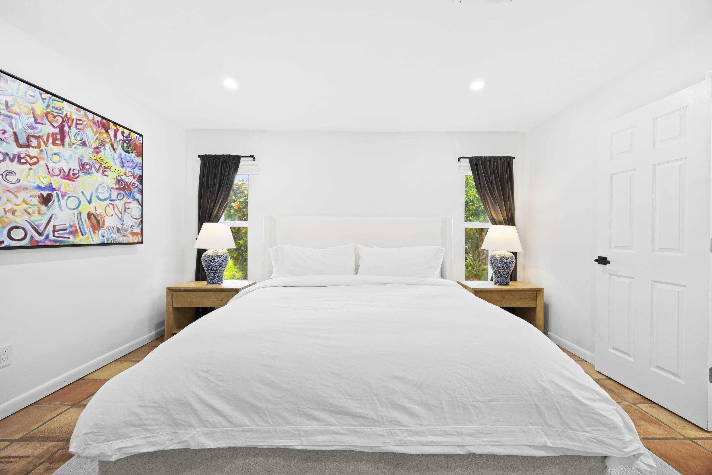 11760 Inverness Circle Wellington, FL 33414 - Photo 17 of 33 a bedroom with a bed and a painting on the wall