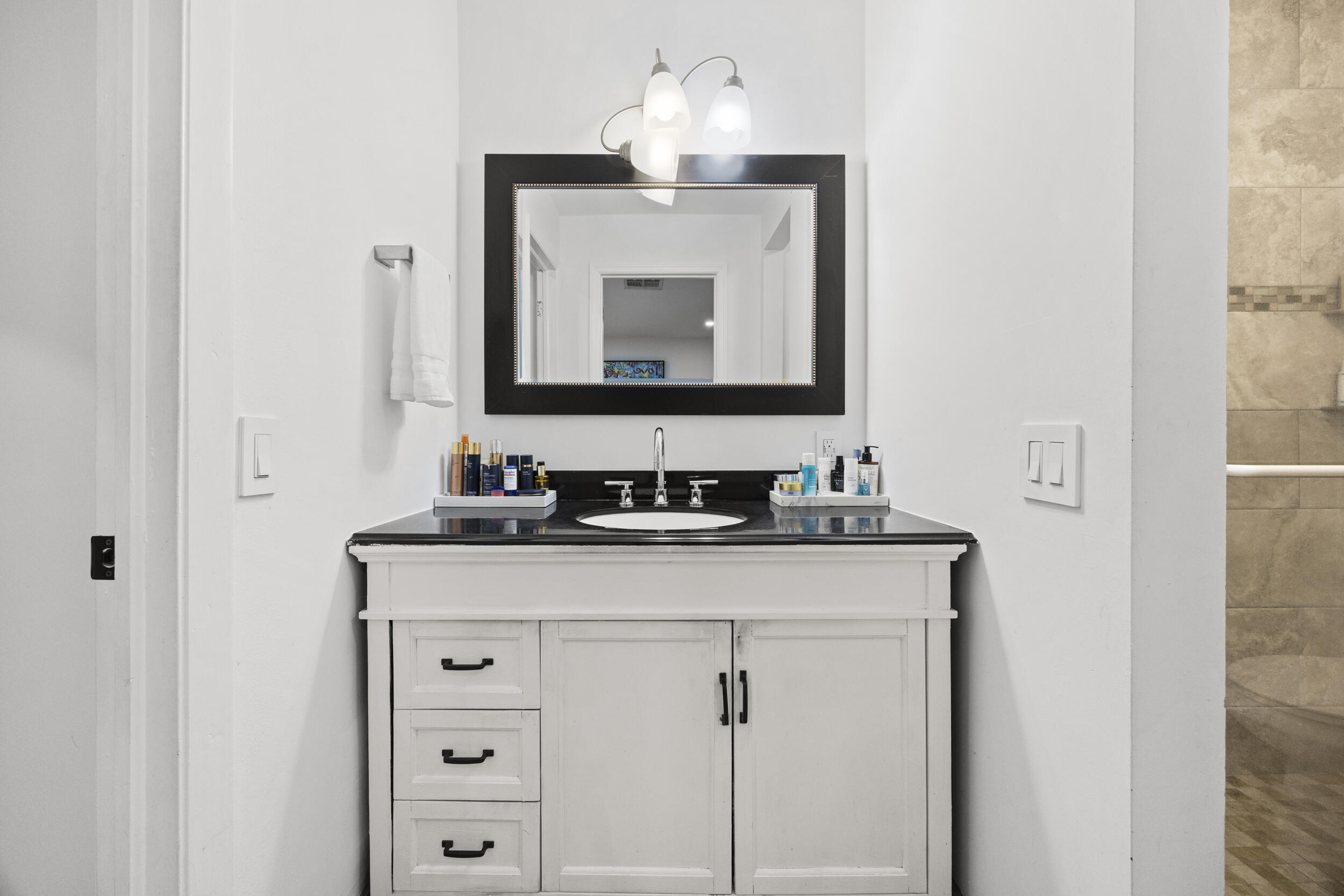 11760 Inverness Circle Wellington, FL 33414 - Photo 18 of 33 a bathroom with a sink and a mirror