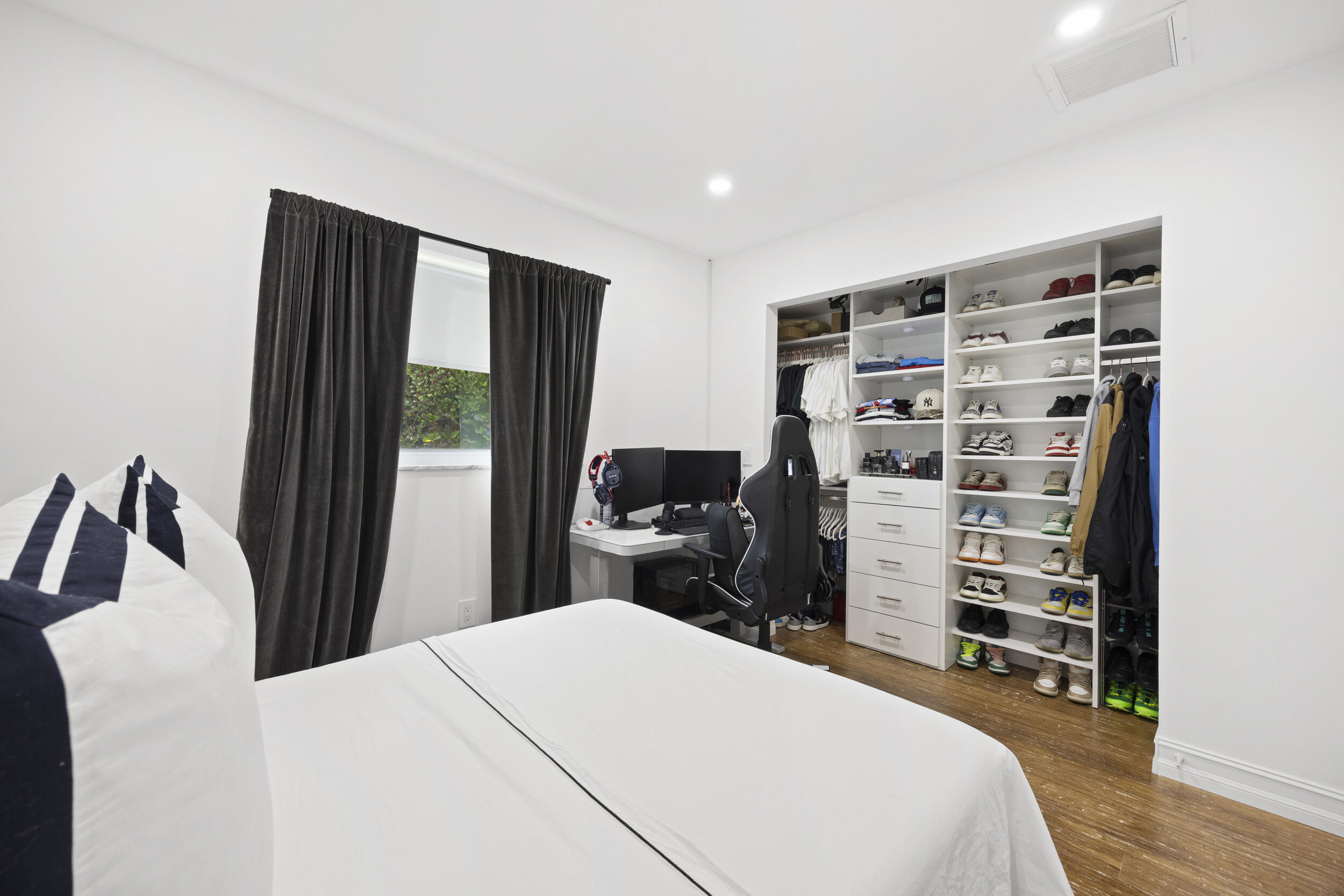 11760 Inverness Circle Wellington, FL 33414 - Photo 21 of 33 a bedroom with a bed and a television