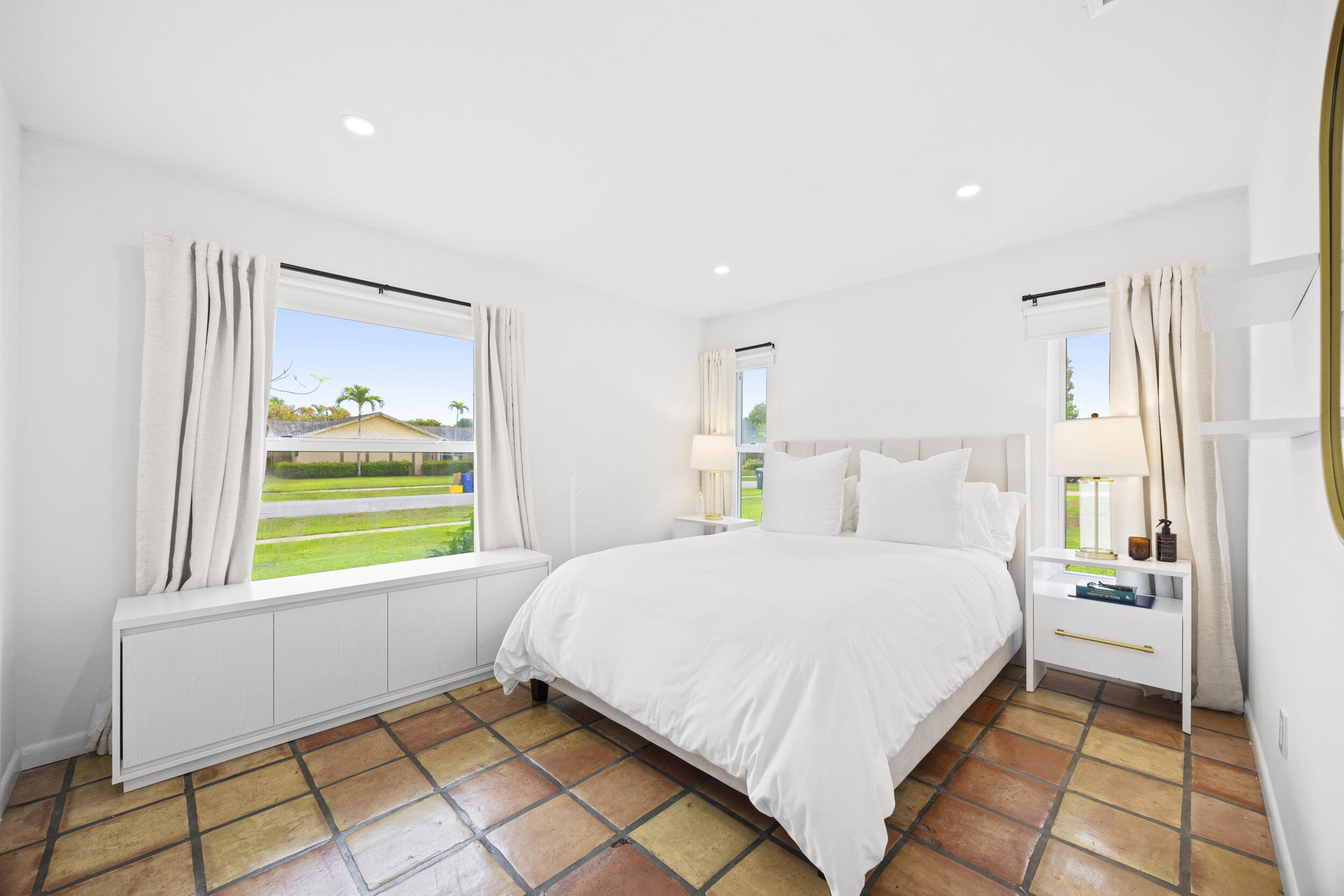 11760 Inverness Circle Wellington, FL 33414 - Photo 22 of 33 a bedroom with a bed and a window