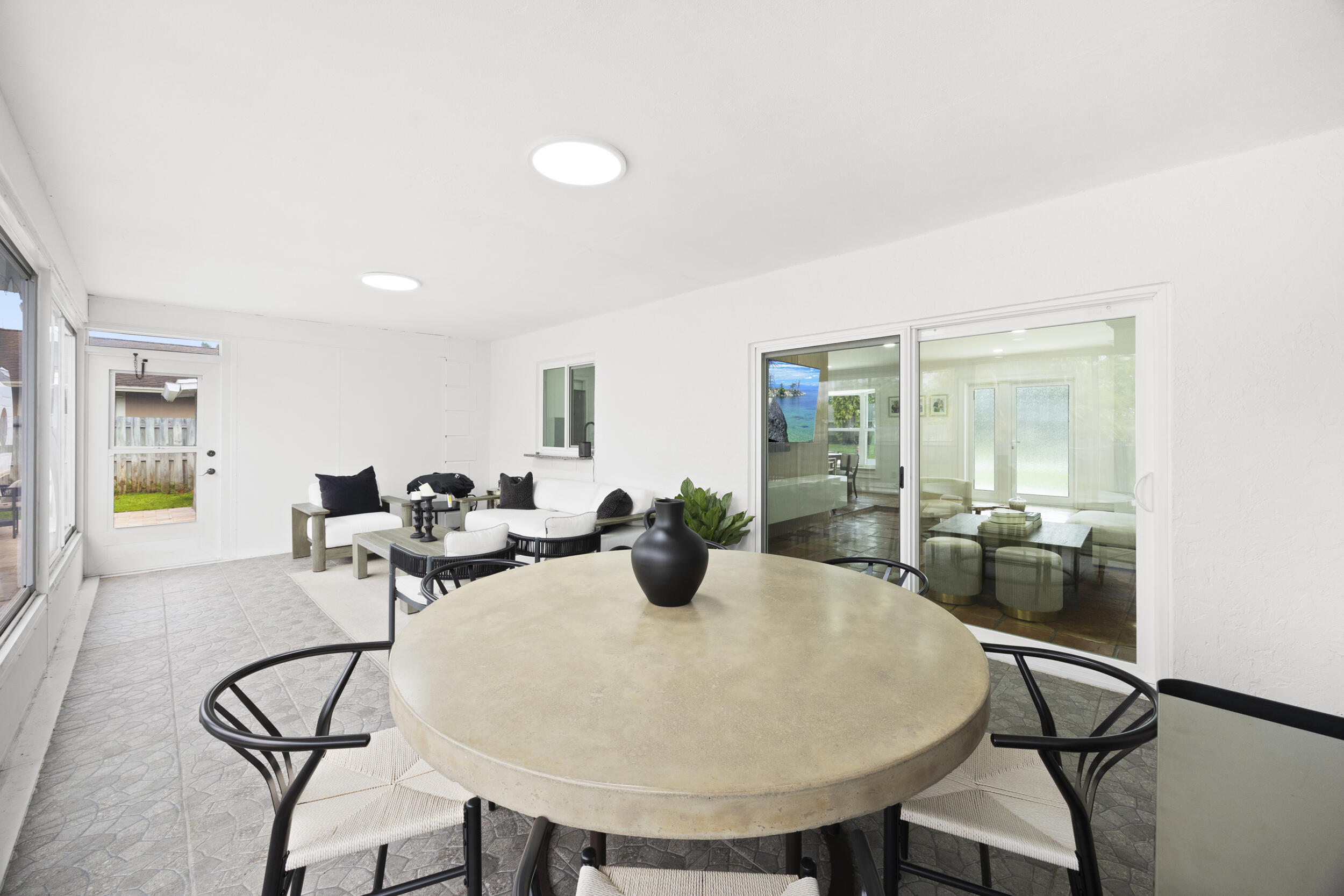 11760 Inverness Circle Wellington, FL 33414 - Photo 25 of 33 a view of a dining room with furniture and wooden floor
