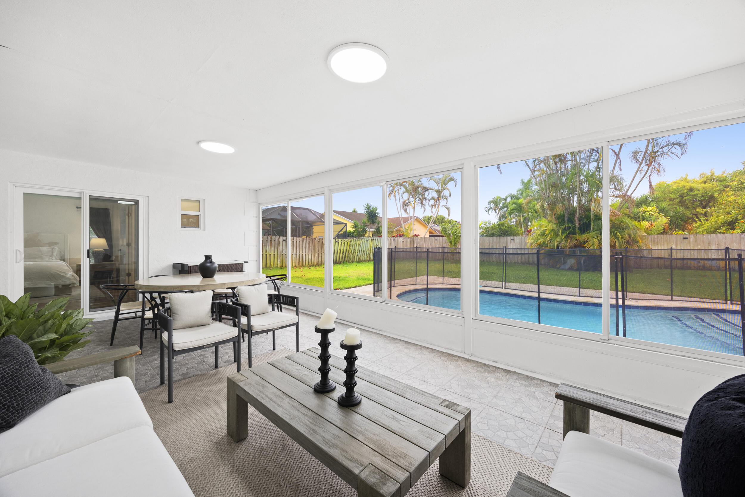 11760 Inverness Circle Wellington, FL 33414 - Photo 26 of 33 a living room with furniture and a large window
