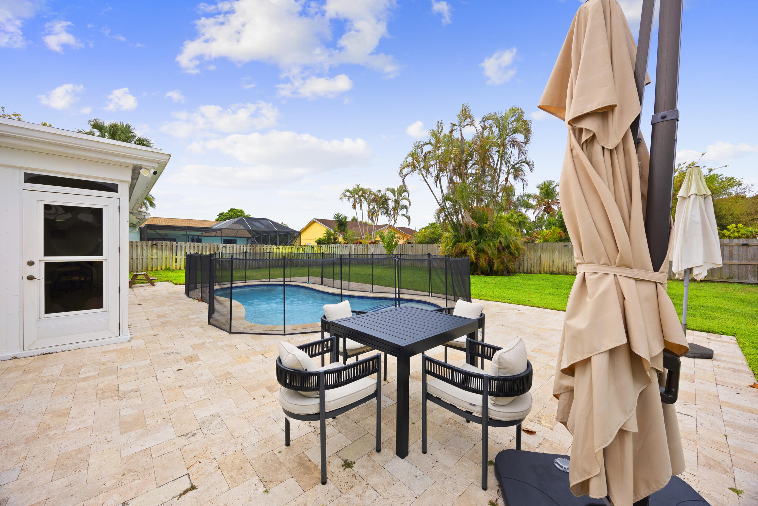 11760 Inverness Circle Wellington, FL 33414 - Photo 27 of 33 a view of outdoor space yard and patio