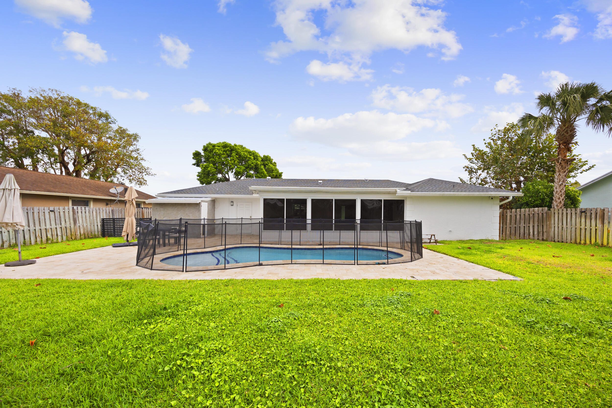 11760 Inverness Circle Wellington, FL 33414 - Photo 29 of 33 a view of a house with a yard and sitting area