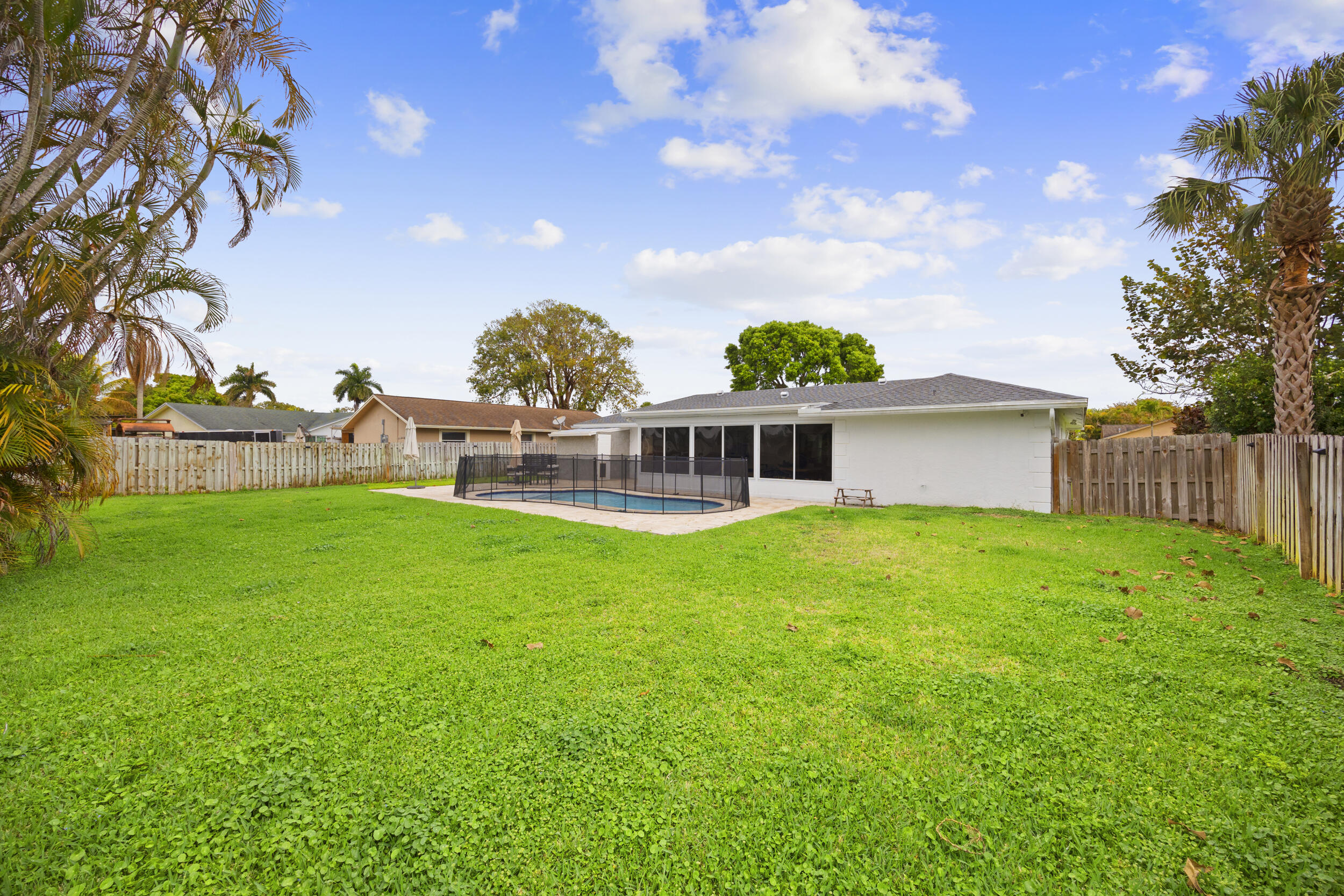 11760 Inverness Circle Wellington, FL 33414 - Photo 30 of 33 a front view of a house with garden
