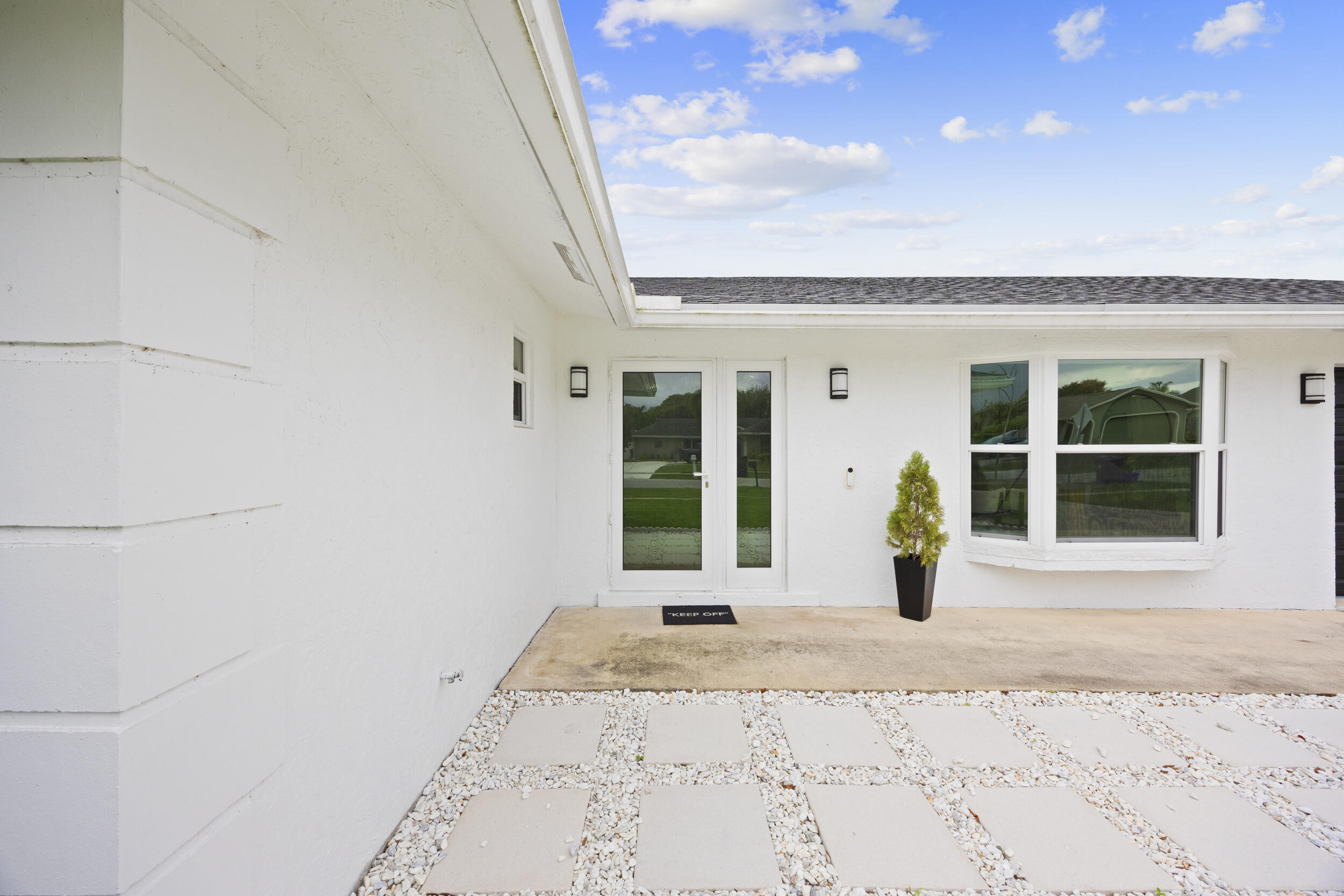 11760 Inverness Circle Wellington, FL 33414 - Photo 3 of 33 a front view of a house with a outdoor space