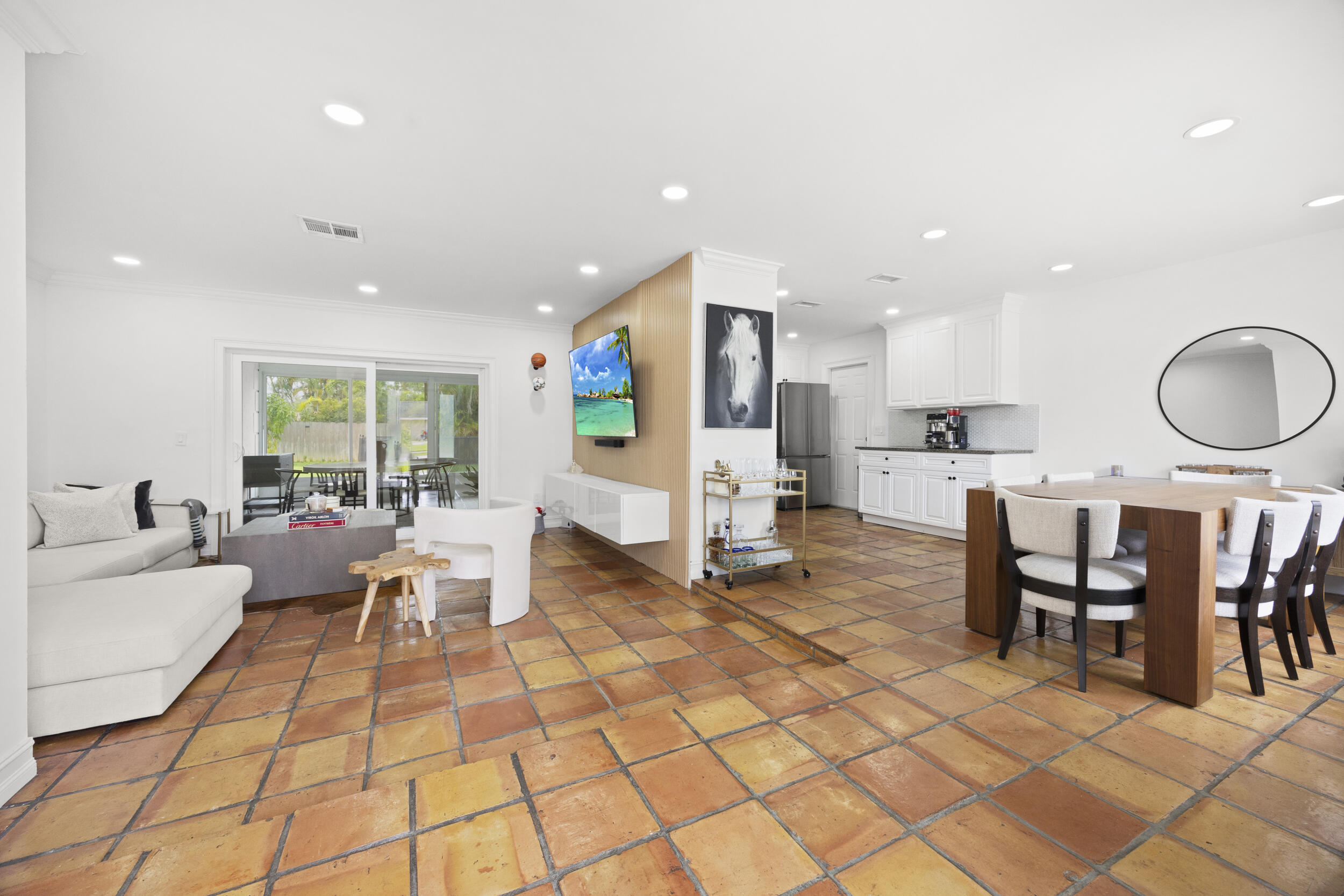 11760 Inverness Circle Wellington, FL 33414 - Photo 4 of 33 a living room with furniture a dining table and kitchen view