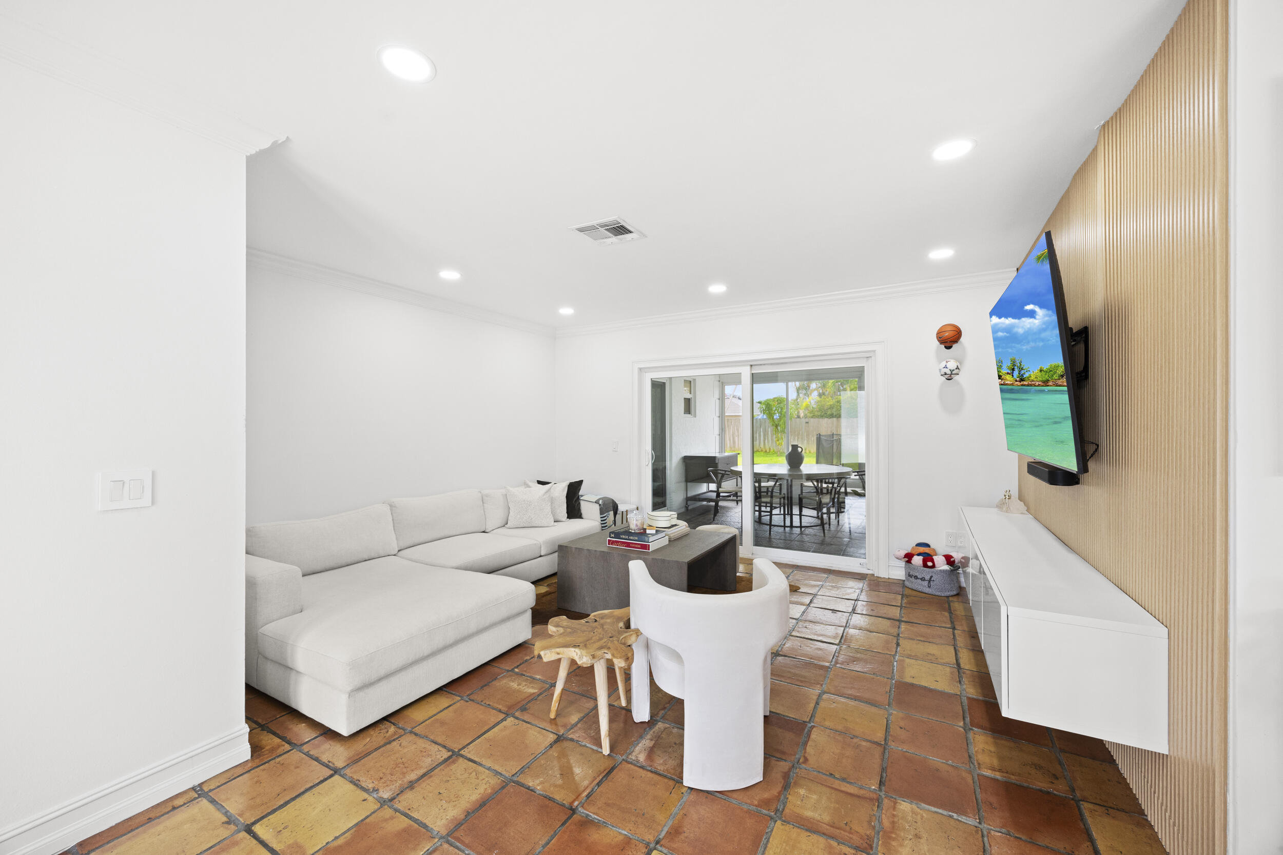 11760 Inverness Circle Wellington, FL 33414 - Photo 6 of 33 a living room with furniture and a flat screen tv