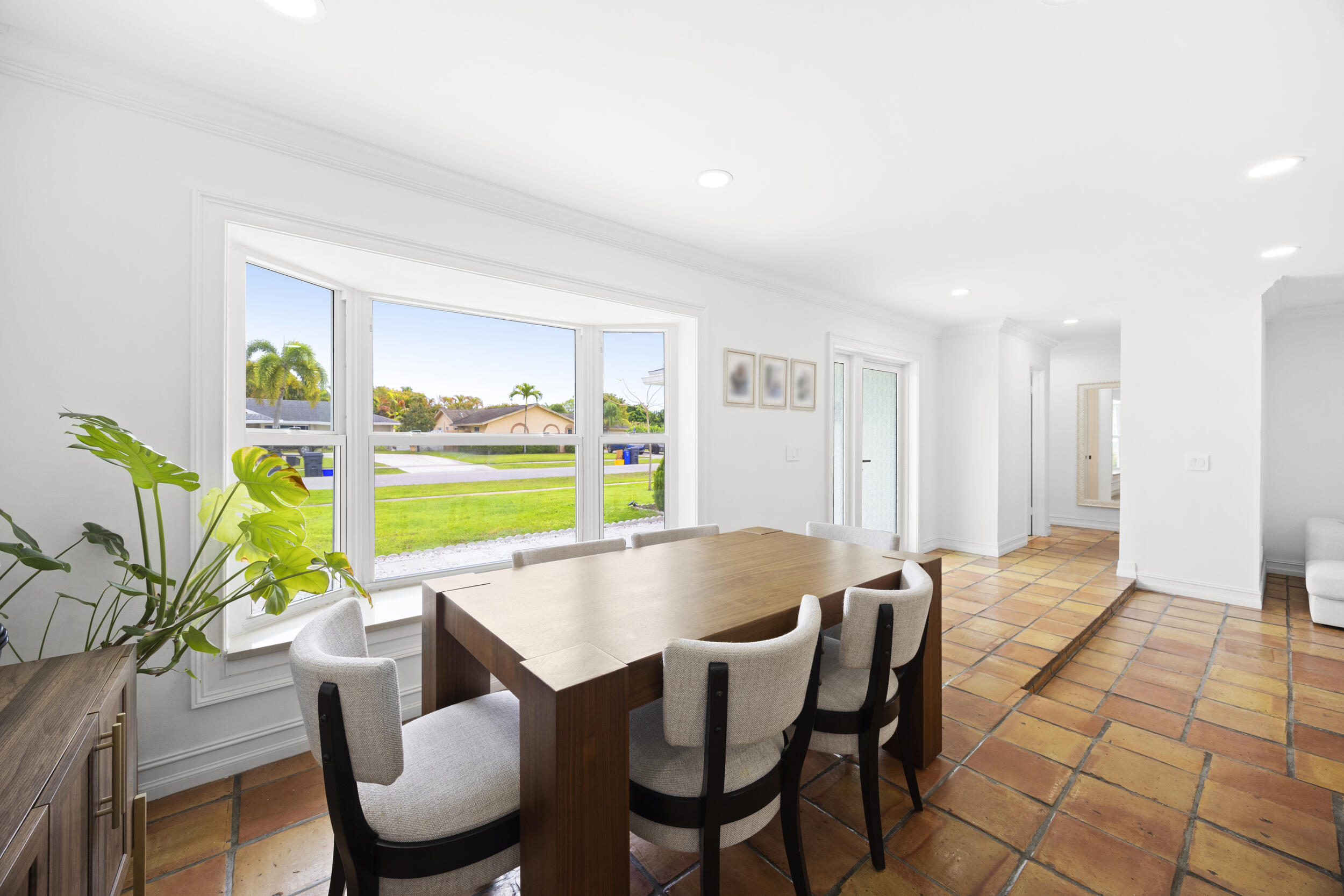 11760 Inverness Circle Wellington, FL 33414 - Photo 10 of 33 a view of a dining room with furniture and a potted plant
