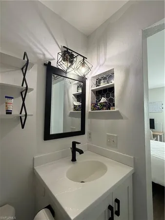 a bathroom with a sink and a mirror