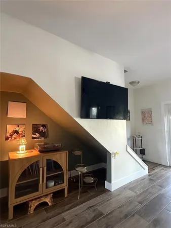 a living room with a flat screen tv and outdoor seating