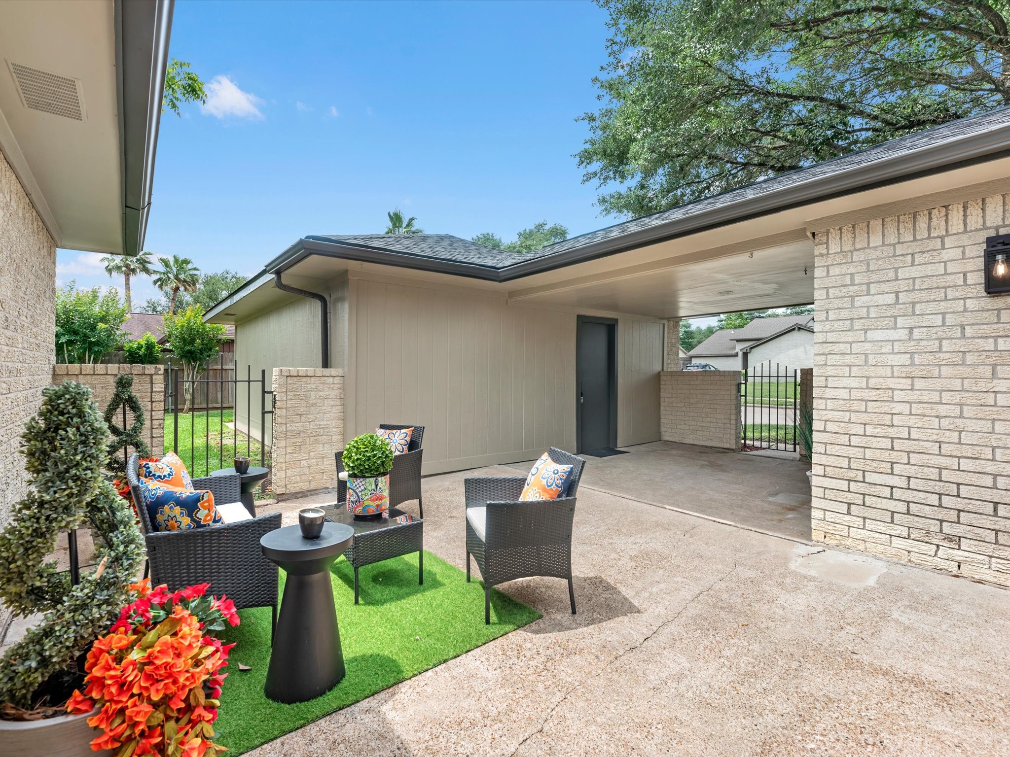 4002 Cujanes Street Pasadena, TX 77504 - Photo 24 of 26 a view of a patio with couches table and chairs and potted plants