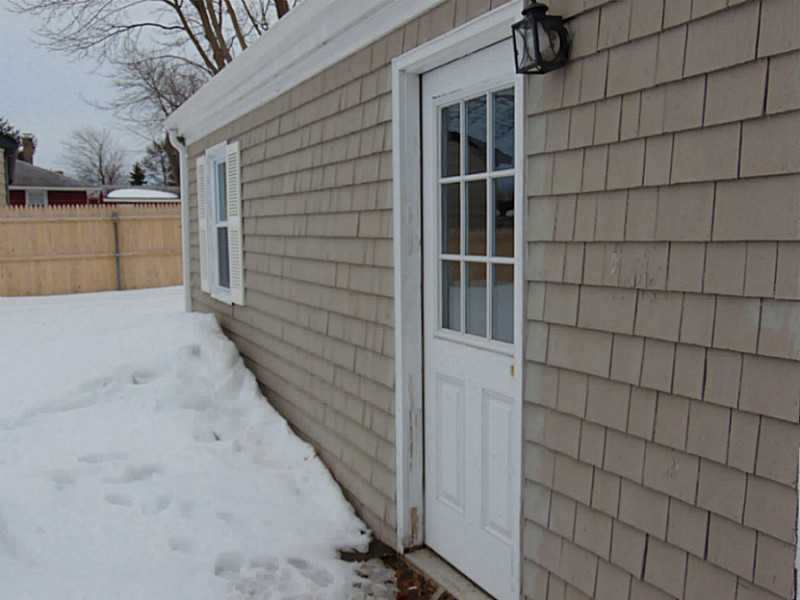 48 Pine Tree Road Portsmouth, RI 02871 - Photo 4 of 25 Exterior Back. Door in side of garage