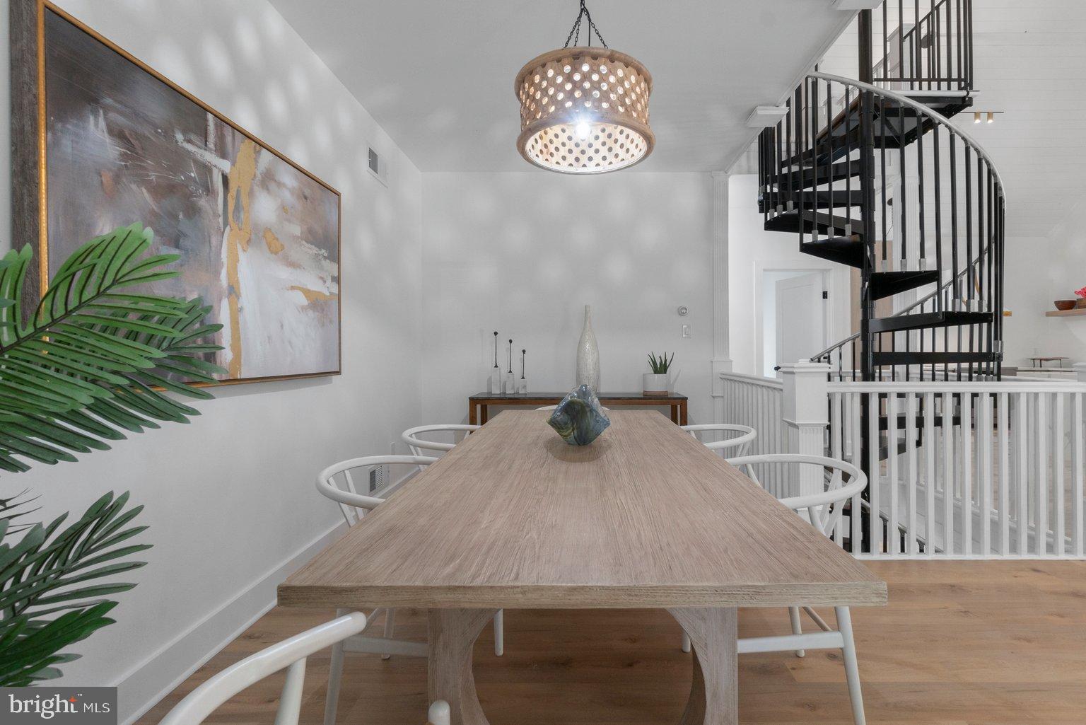 851 Bacon Hall Road Sparks, MD 21152 - Photo 17 of 50 Modern dining space with spiral staircase.