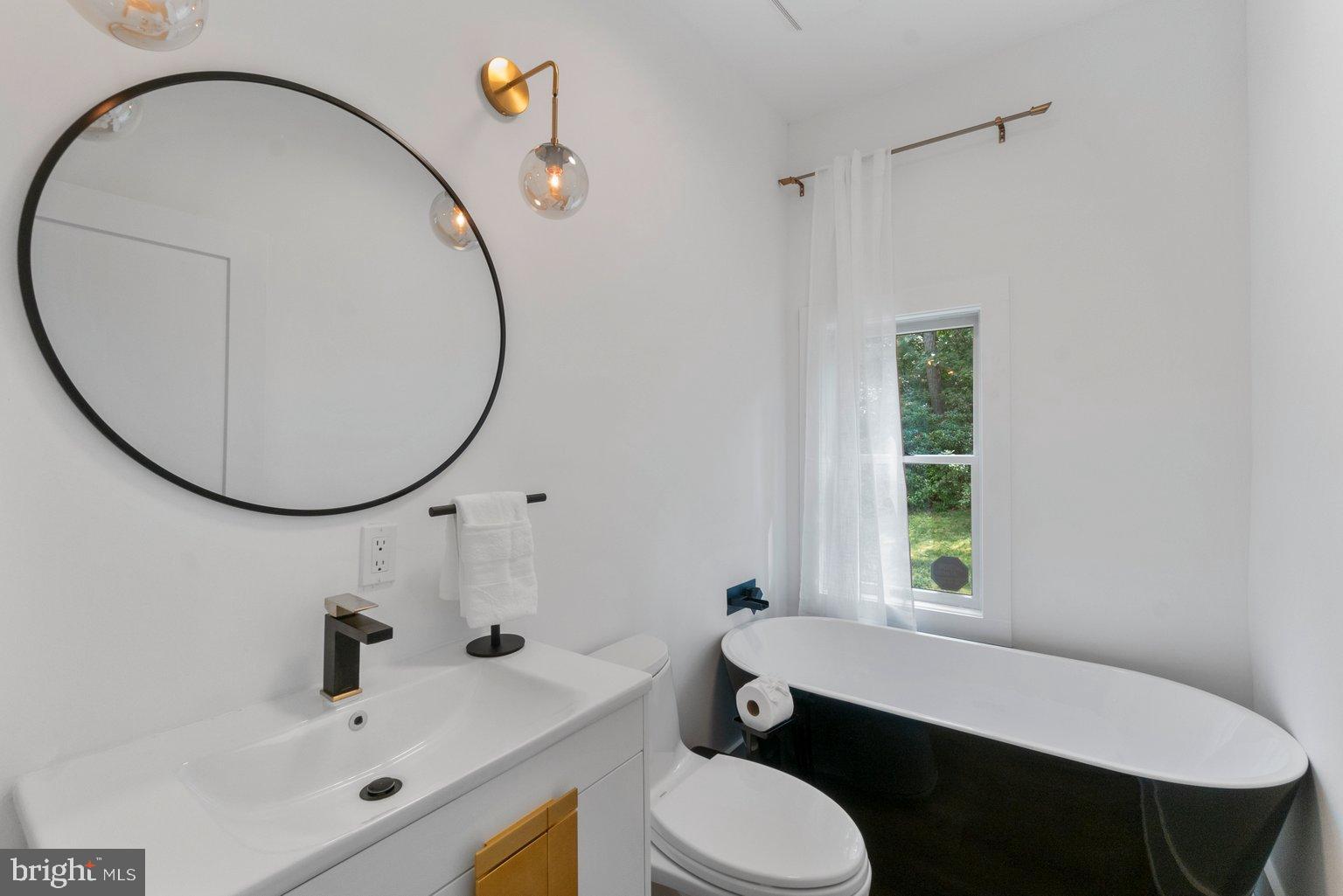 851 Bacon Hall Road Sparks, MD 21152 - Photo 26 of 50 Sleek modern bathroom with natural light.