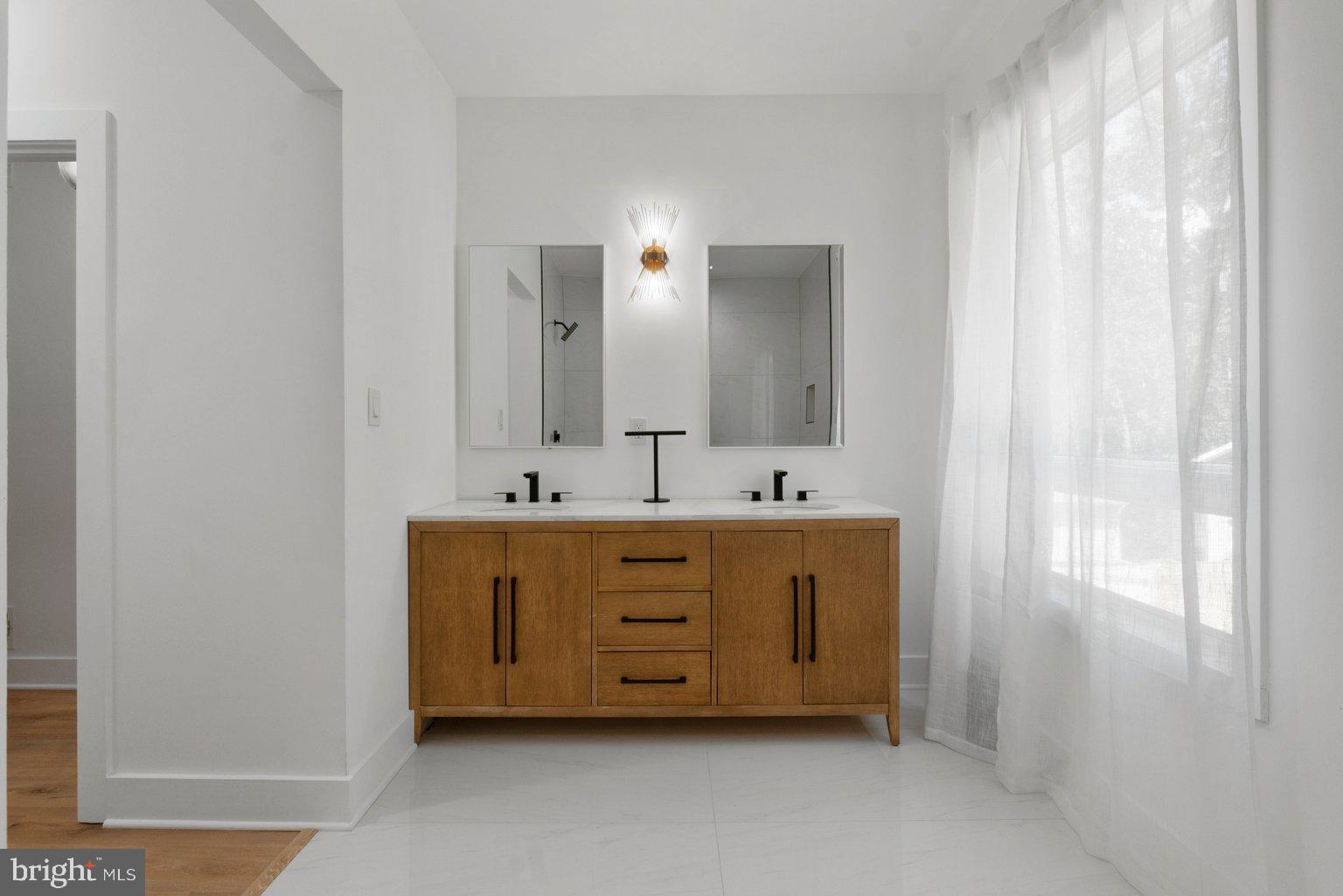 851 Bacon Hall Road Sparks, MD 21152 - Photo 31 of 50 Sleek modern bathroom with natural light.