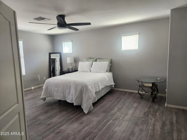 a bedroom with a bed and a table