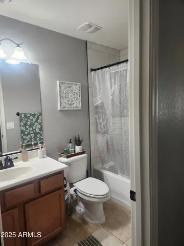 a bathroom with a toilet a sink and a shower