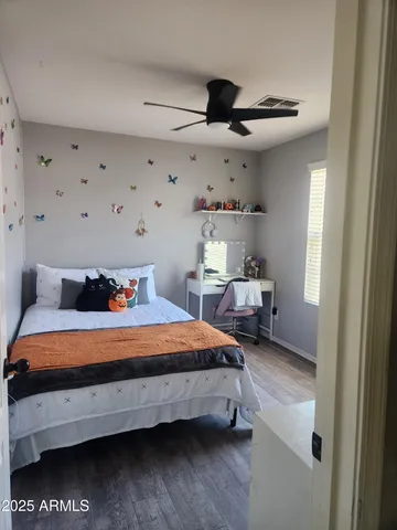 a bedroom with bed and window