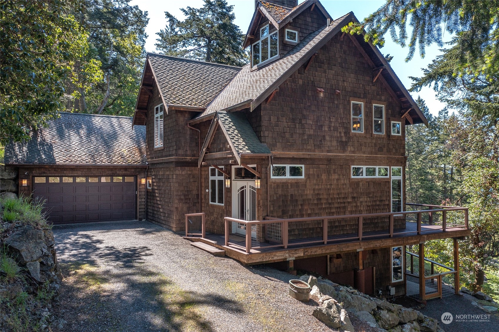 2270 Spring Point Road Orcas Island, WA 98245 - Photo 2 of 40 a front view of a house with garage