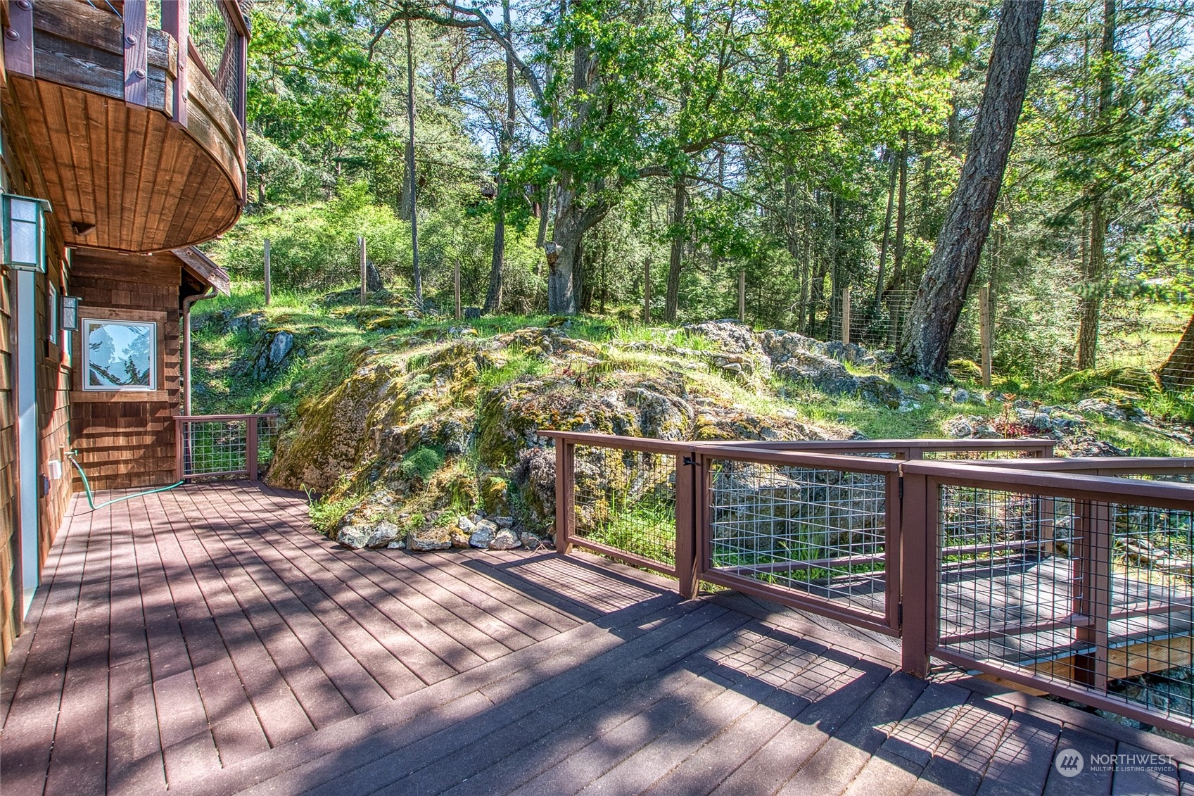 2270 Spring Point Road Orcas Island, WA 98245 - Photo 32 of 40 a view of a wooden deck with a yard