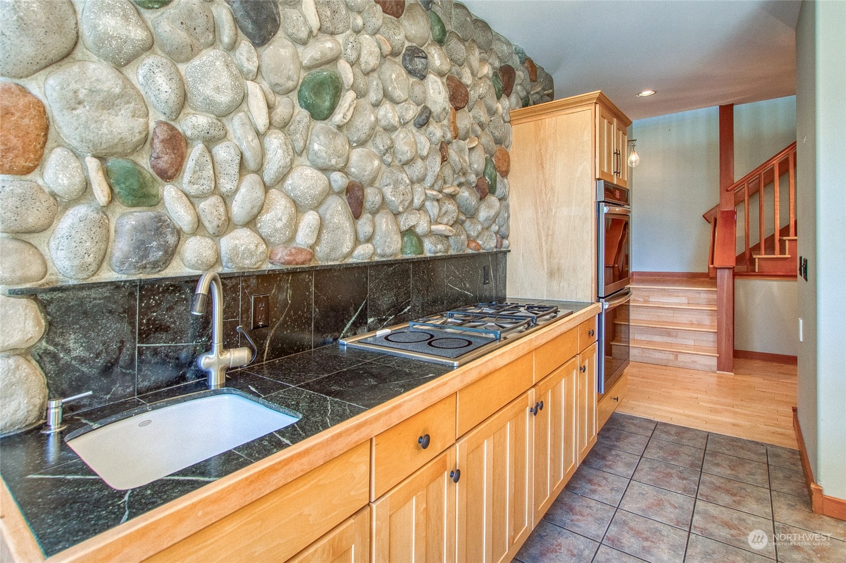 2270 Spring Point Road Orcas Island, WA 98245 - Photo 8 of 40 a kitchen with stainless steel appliances granite countertop a sink stove and cabinets