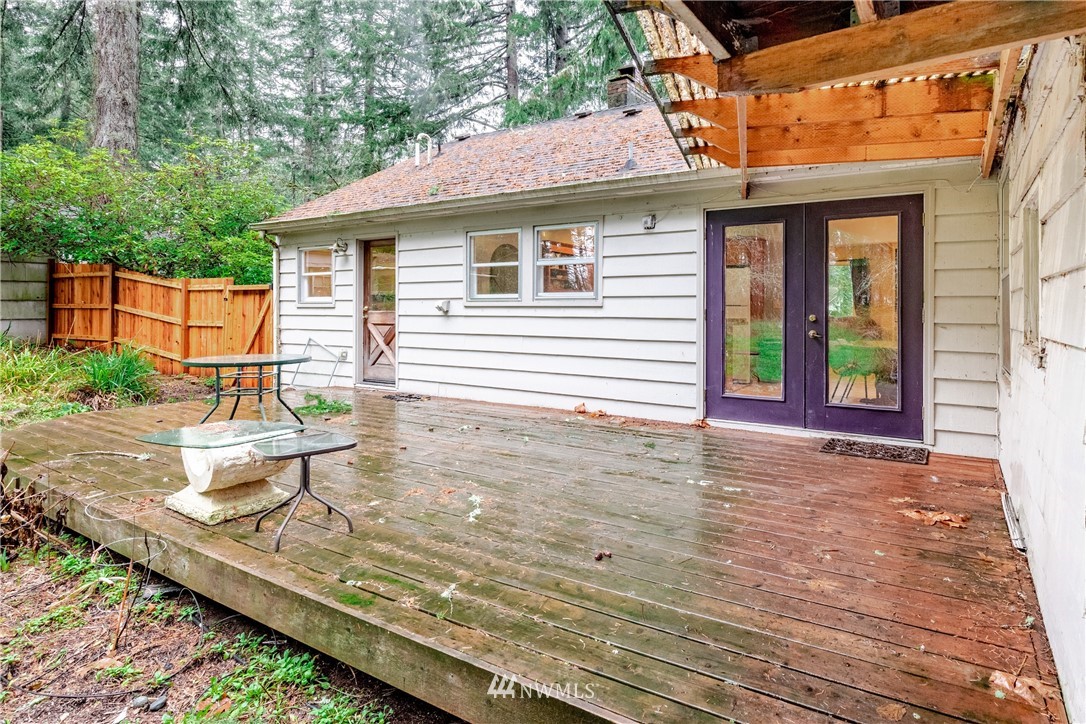 4004 Cooper Point Road Northwest Olympia, WA 98502 - Photo 23 of 28 a view of a house with backyard and sitting area