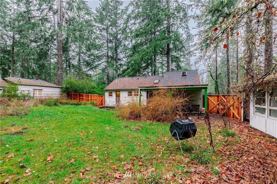 4004 Cooper Point Road Northwest Olympia, WA 98502 - Photo 26 of 28 a view of a house with backyard porch and sitting area