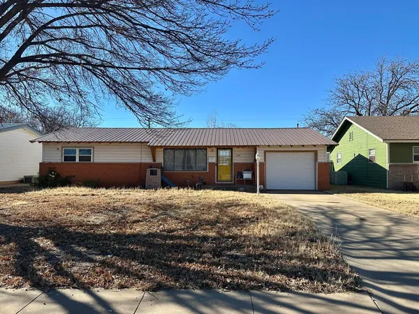 a house with yard in front of it